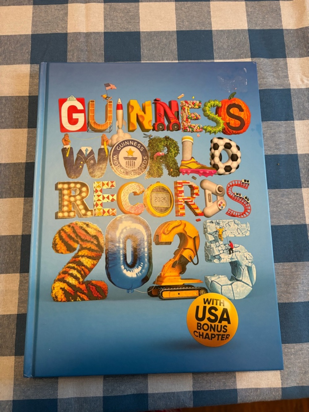 Guinness World Records 2025 Hardcover - Blue with Multicolored Artwork
